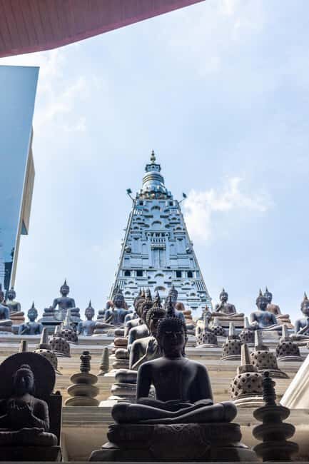Colombo: HALF A DAY TOUR FROM NEGOMBO by car with Guiding - Gangaramaya Temple: elegant Colombo with a local-style offering
