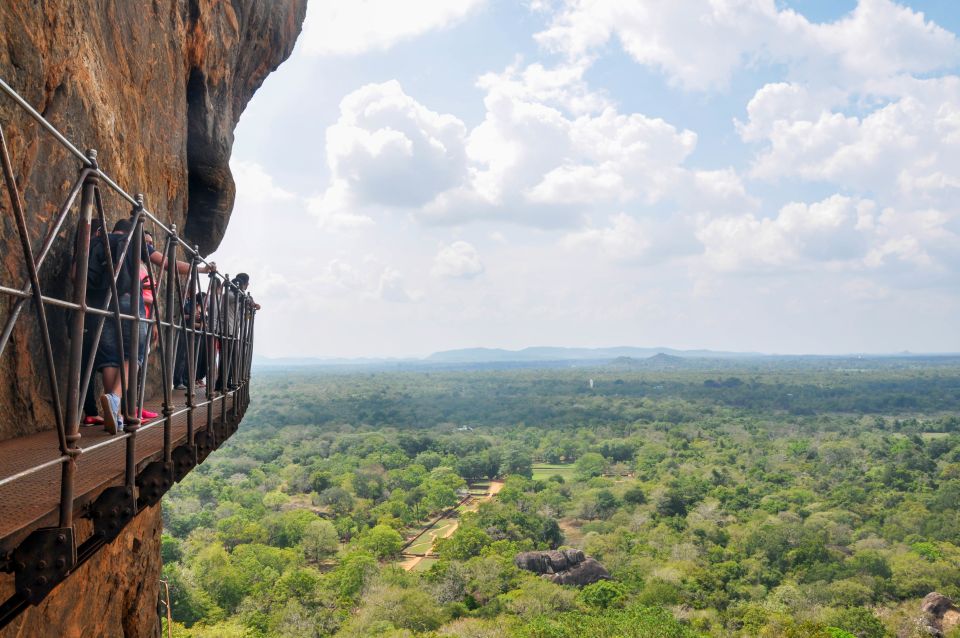 From Kandy: Sigiriya and Dambulla Private Day Tour - Golden Temple of Dambulla: caves packed with Buddha murals and statues